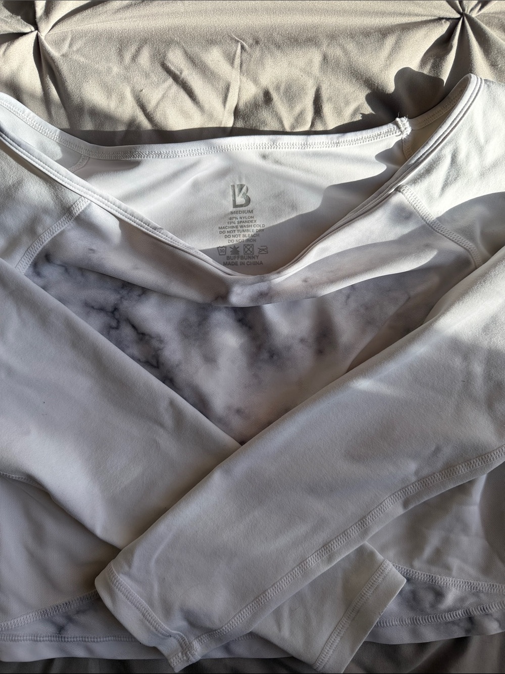 BuffBunny White Long-Sleeve Performance Crop Top with Marble Lining